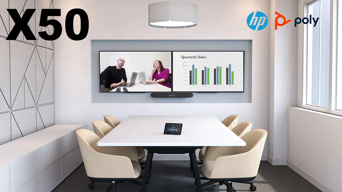 An elegantly designed conference room equipped with the HP Poly X50 video conferencing system, featuring two people in a virtual meeting displayed on a large monitor above a white meeting table.